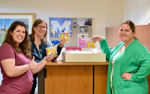 Photo of Student and Academic Services team with block M cookies