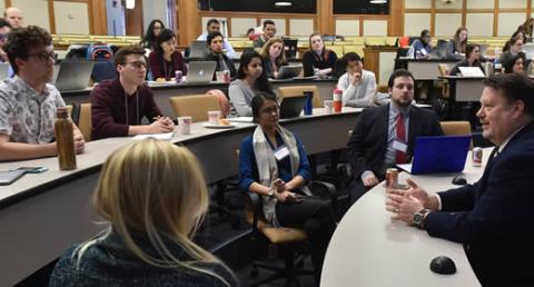 Photo of students engaging with a local policymaker
